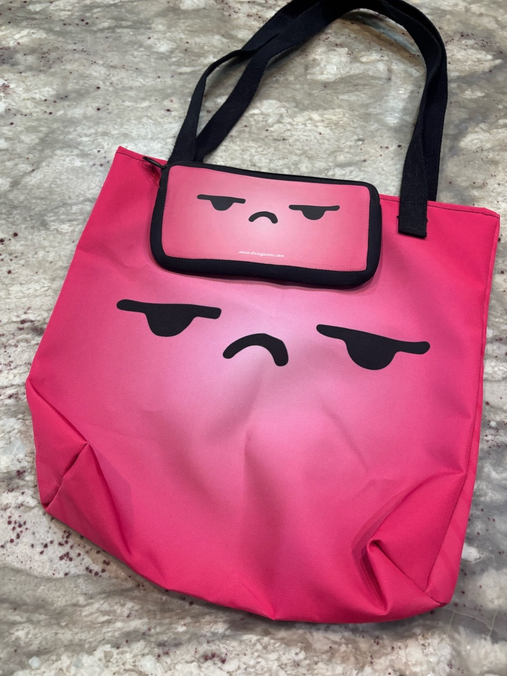 Pink Tote Bag with Grumpy Face Design with matching pencil case.